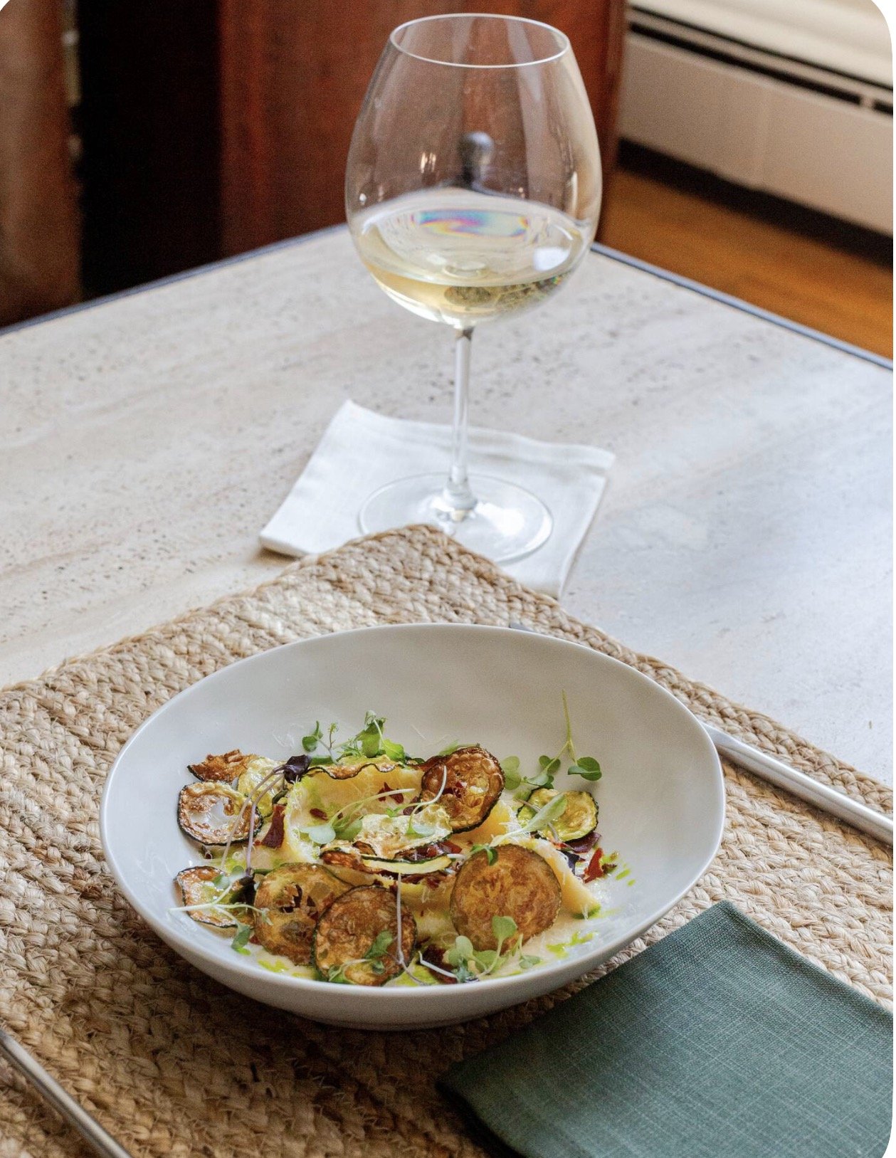 Chef Jacob’s seared scallops, plated at a private dining table